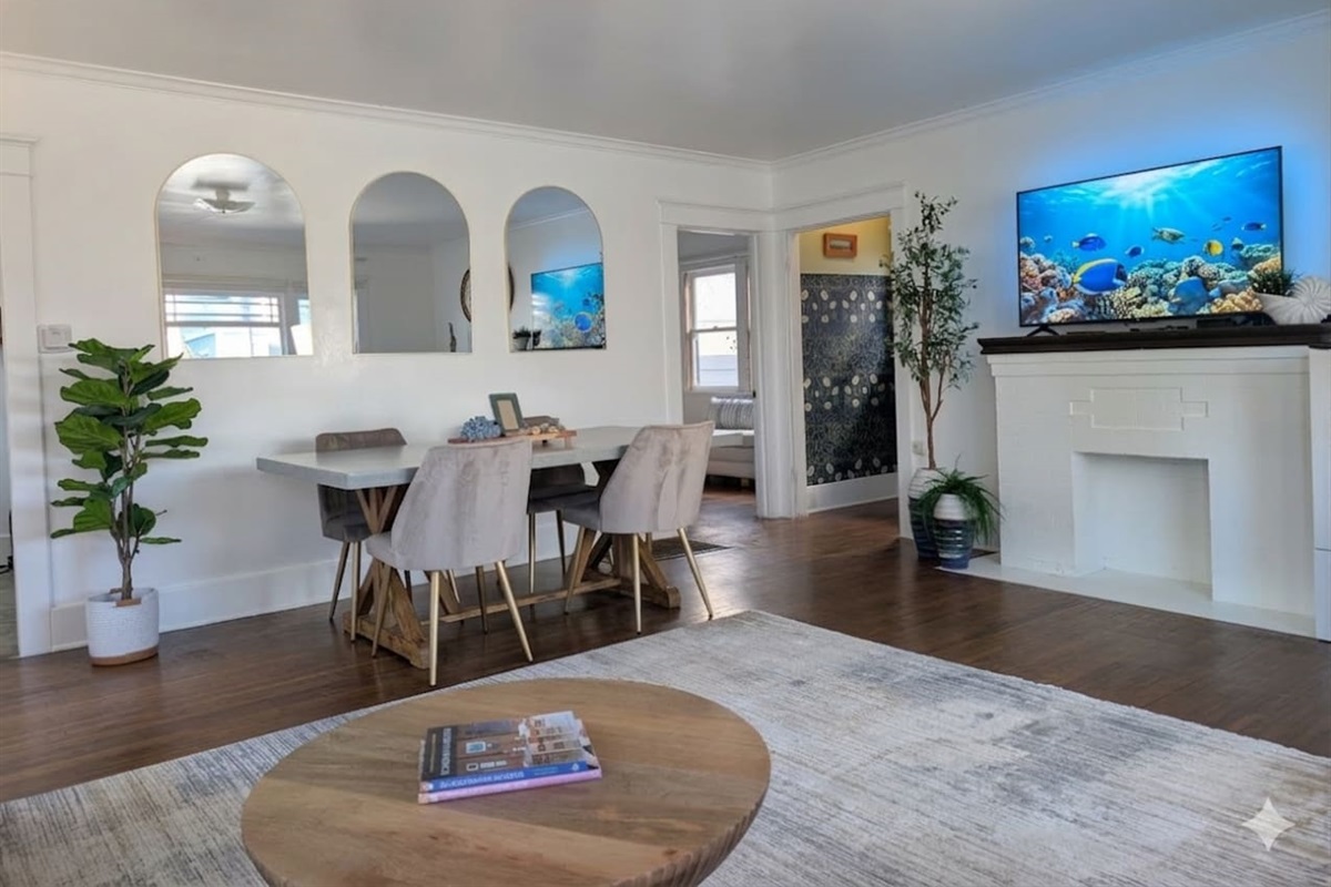 Open-concept living and dining area with TV, comfortable seating and spending time together.