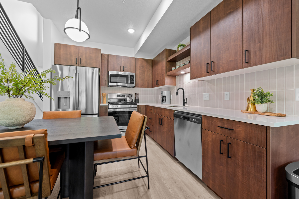 Fully equipped kitchen with stainless steel appliances and ample counter space.