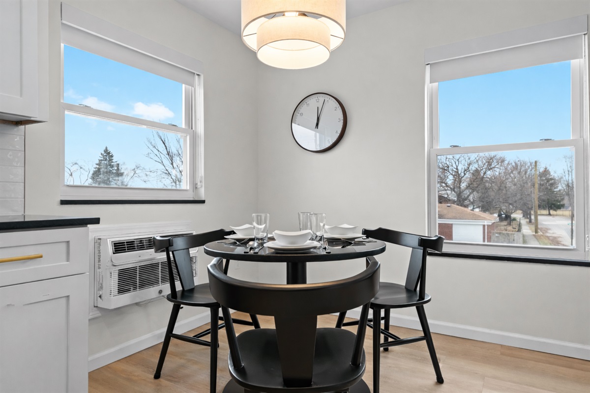 Inviting dining space with a modern table, cozy seating, and sunny window views—perfect for shared meals, coffee mornings, and relaxed evenings.