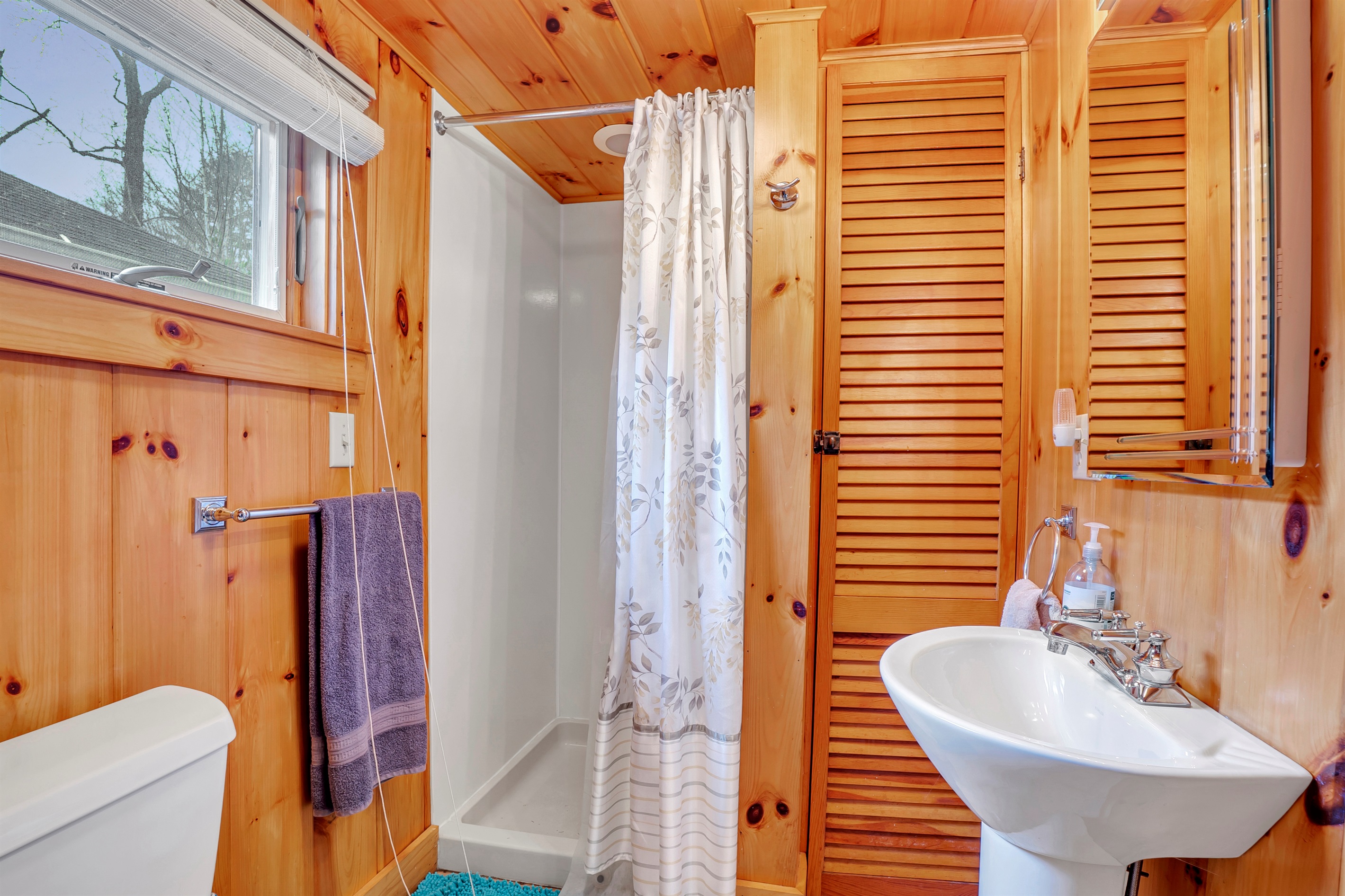 Bathroom with shower off kitchen