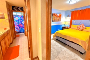 Charming queen-sized bed bedroom with a queen bed, complemented by a bathroom just outside for added convenience