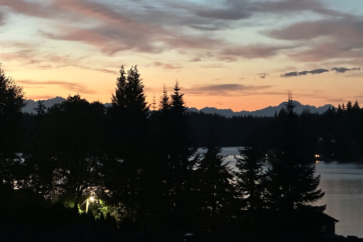 The magic hour brings calm waters and breathtaking mountain silhouettes