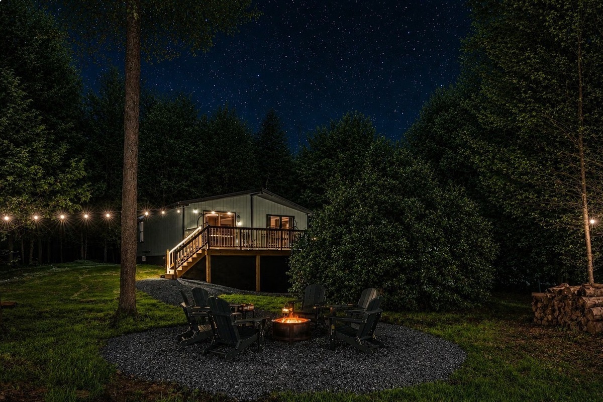 🔥 Gather around the firepit under string lights as the forest goes quiet.