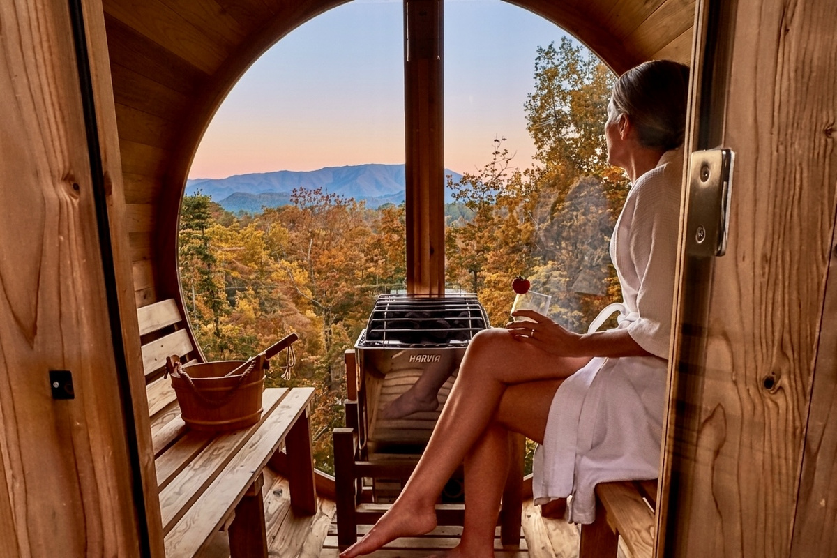 Relax and unwind in a glass wall barrel sauna while taking in majestic views of the Great Smoky Mountains!