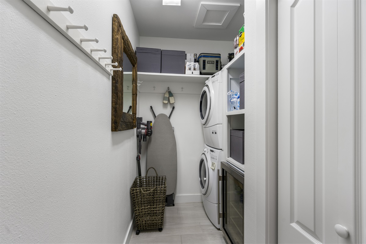 Laundry Area with Stackable Washer /Dryer and Beverage Cooler