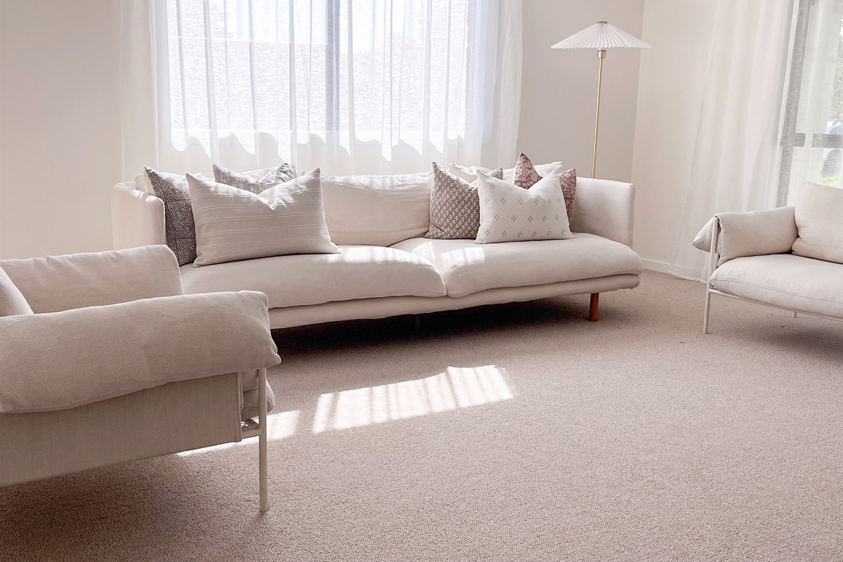 This lounge area adds extra sitting space, with a long sofa, armchairs and a quiet corner for slower moments.