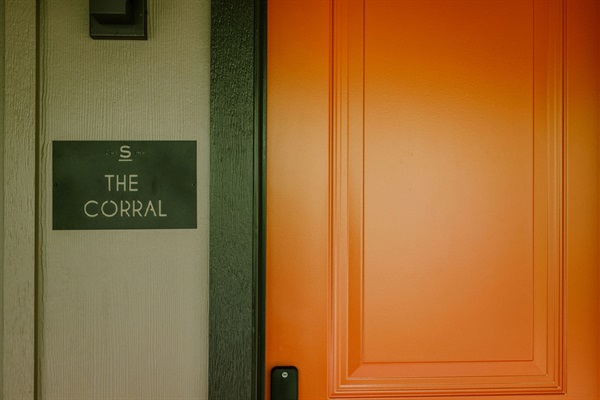 The private entrance to the Corral Suite at Gaines Ranch on the Square &mdash; smart-lock self check-in, no front desk, no waiting.