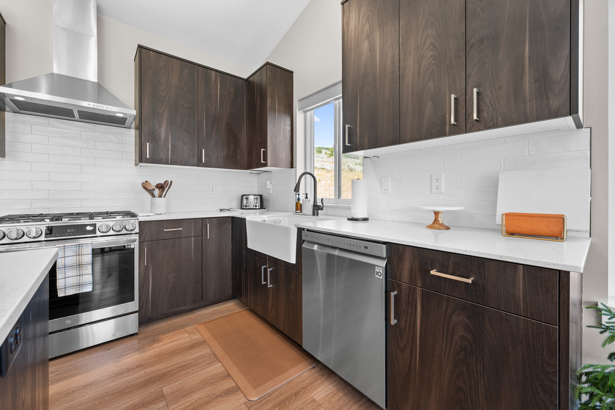 Modern kitchen featuring quartz countertops, generous cabinetry, and everything you need for cooking and dining at home.