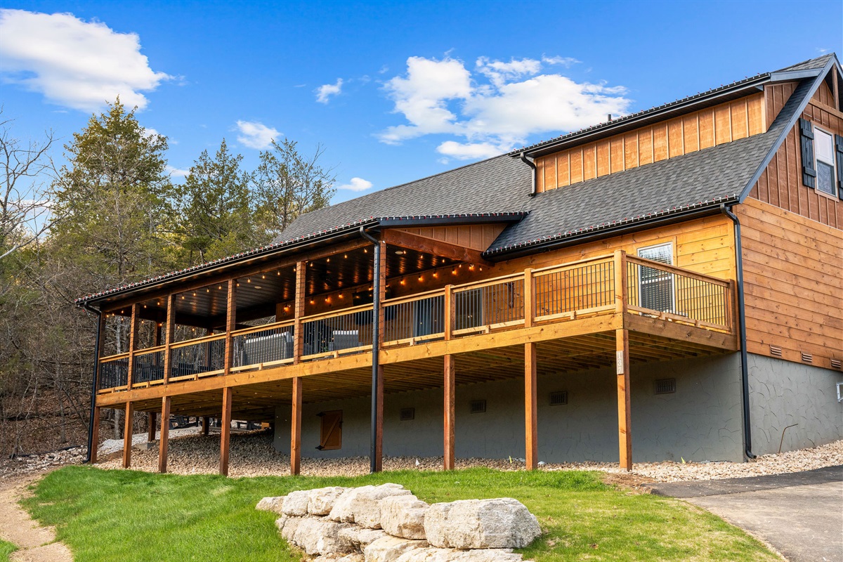 Daytime view of the cabin and wraparound deck.