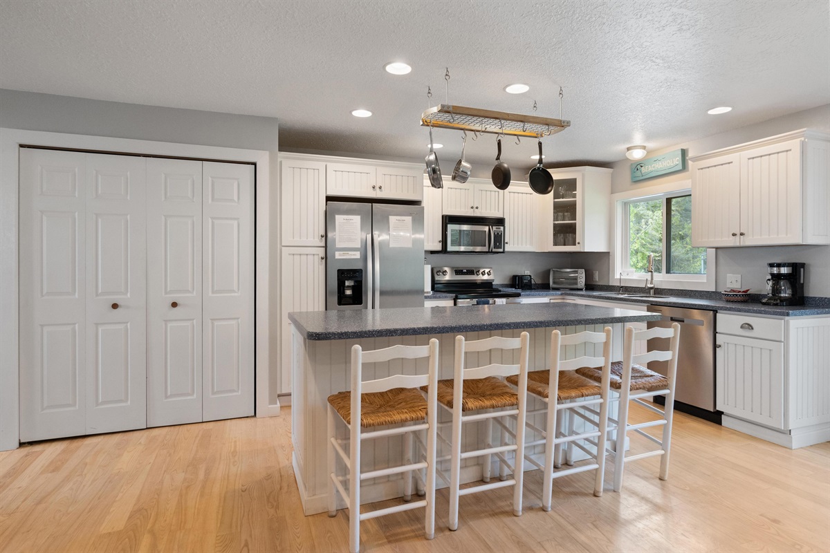 First floor laundry is conveniently located in the closet next to the kitchen with standard capacity washer and dryer