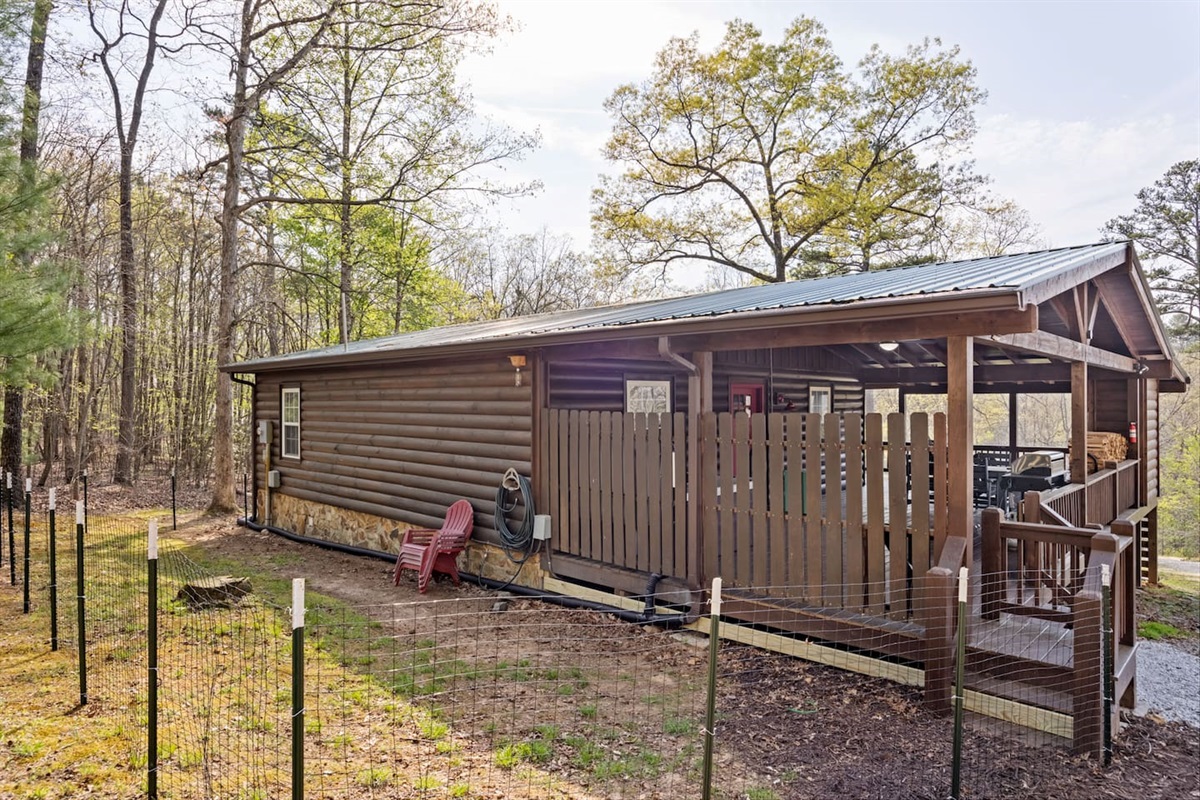 Fenced pet area behind the cabin