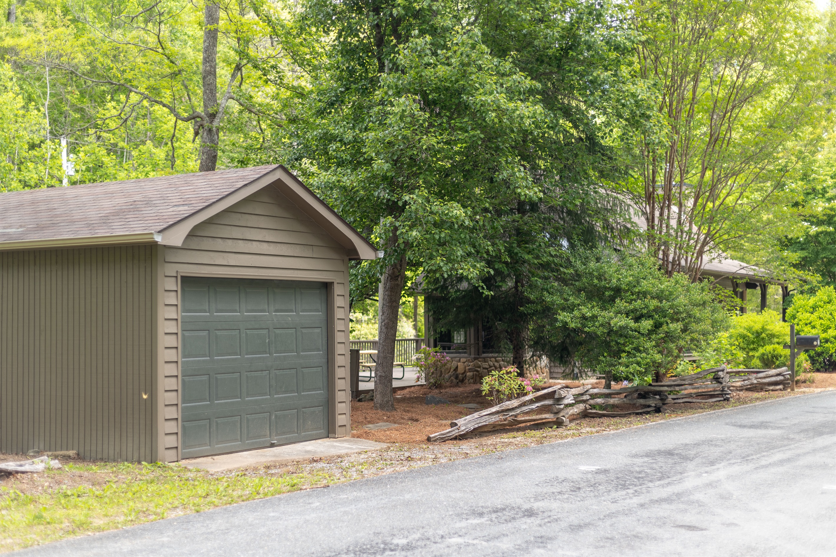 The garage offers convenient covered parking and can accommodate a few motorcycles or even a sports car.