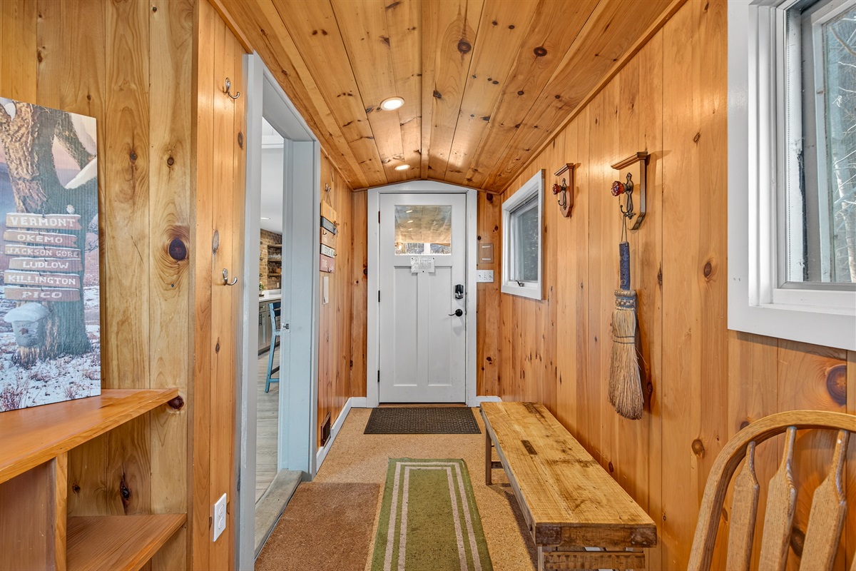 Charming hallway with wood accents and warm lighting.