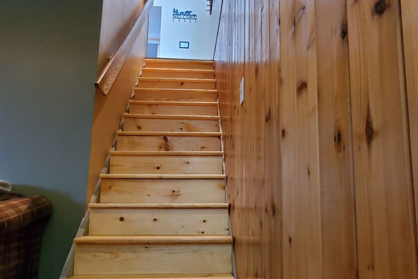 View from bottom of stairs in entry room that lead to the main floor