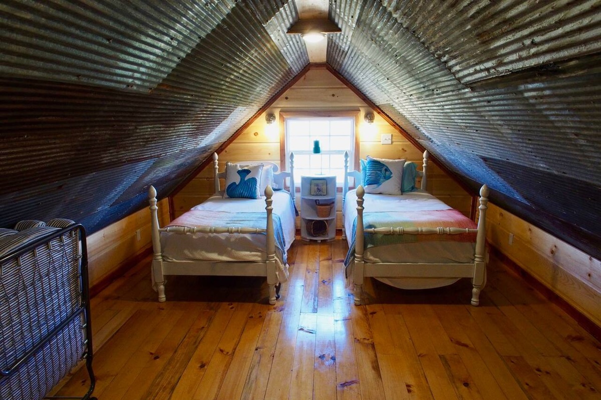 Open Air Loft Area Has Two Twin Beds and One Single Bed