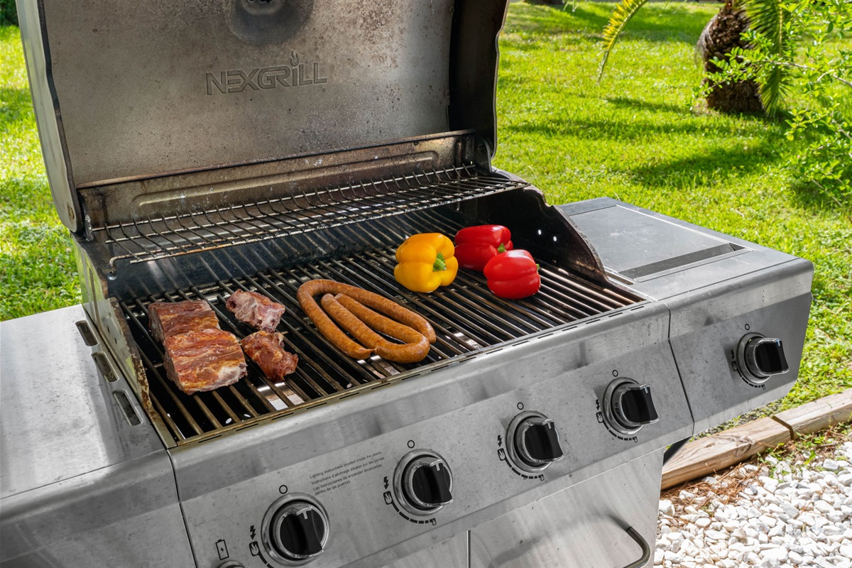 Equipped with a stainless steel grill and ample seating, this outdoor space is ideal for hosting barbecues and gatherings with family and friends.