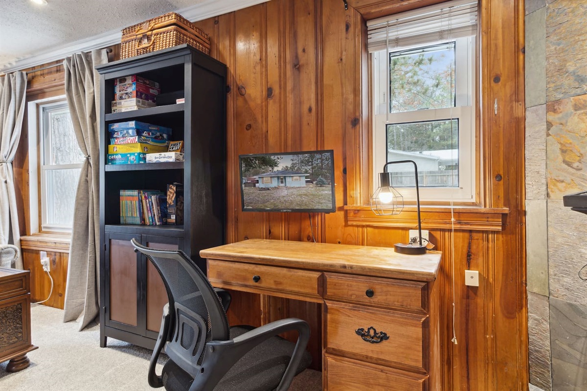Small desk with storage, extra monitor for the dual-taskers or gamers of the group. Located in living room,  HDMI cable will be needed.