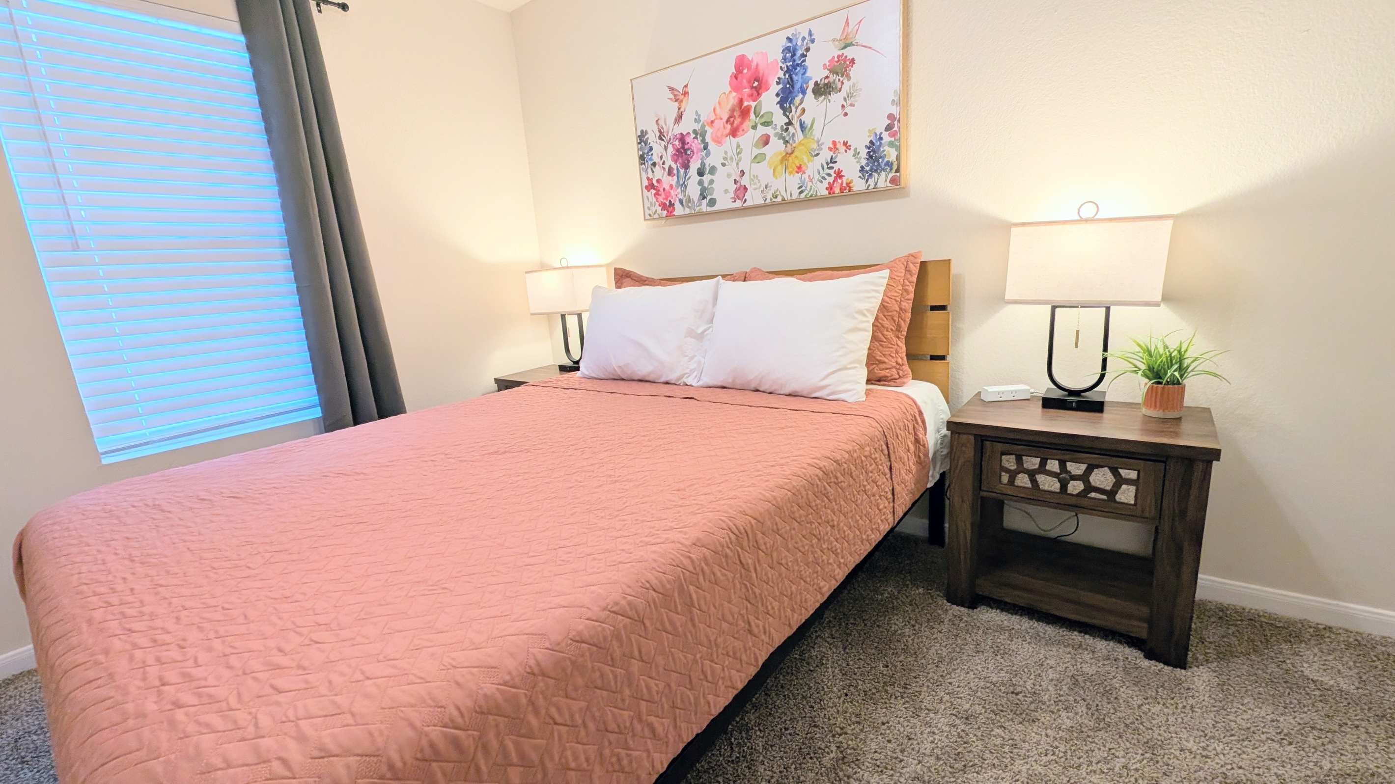 Comfort meets convenience in this peaceful queen bedroom, designed for a great night's rest.