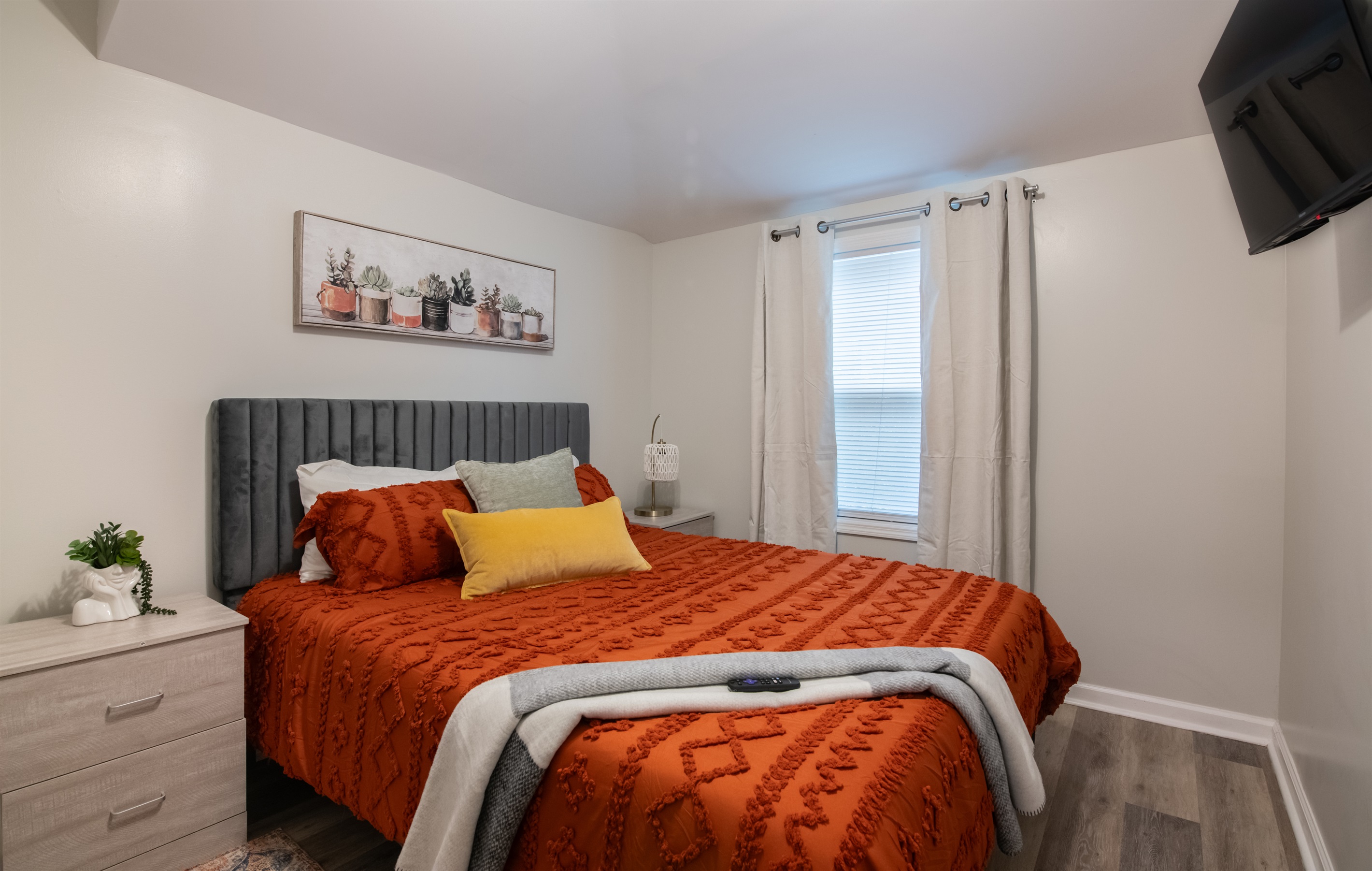 A warm and inviting guest room with a comfortable bed and peaceful ambiance.