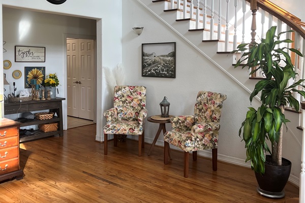 Beautiful curved staircase with enormous 21ft ceiling.