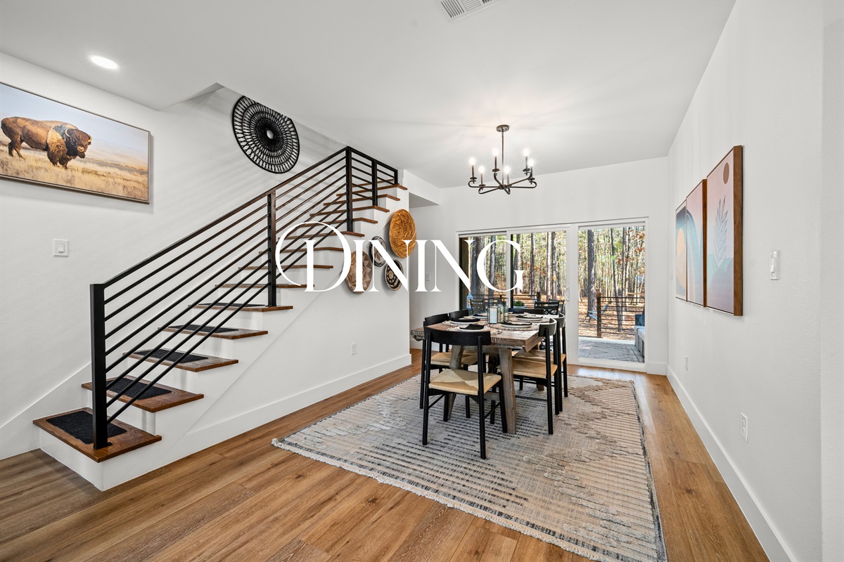 The dining area sits just off the main living space, creating a comfortable setting for meals or game nights.