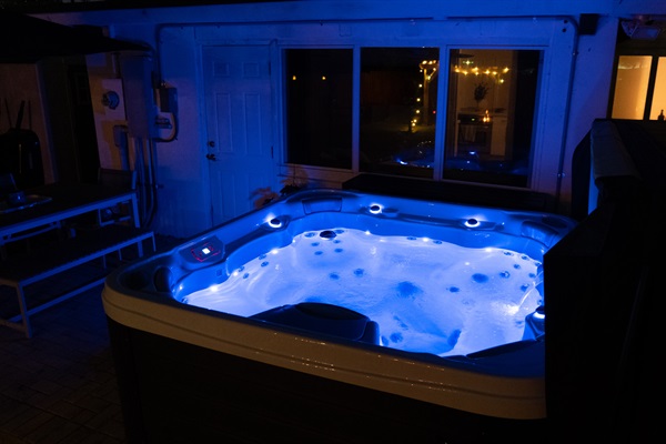 Hot tub lit at night