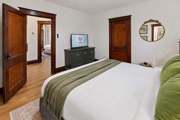 Settle into the primary king suite, your quiet retreat after busy days exploring the city.