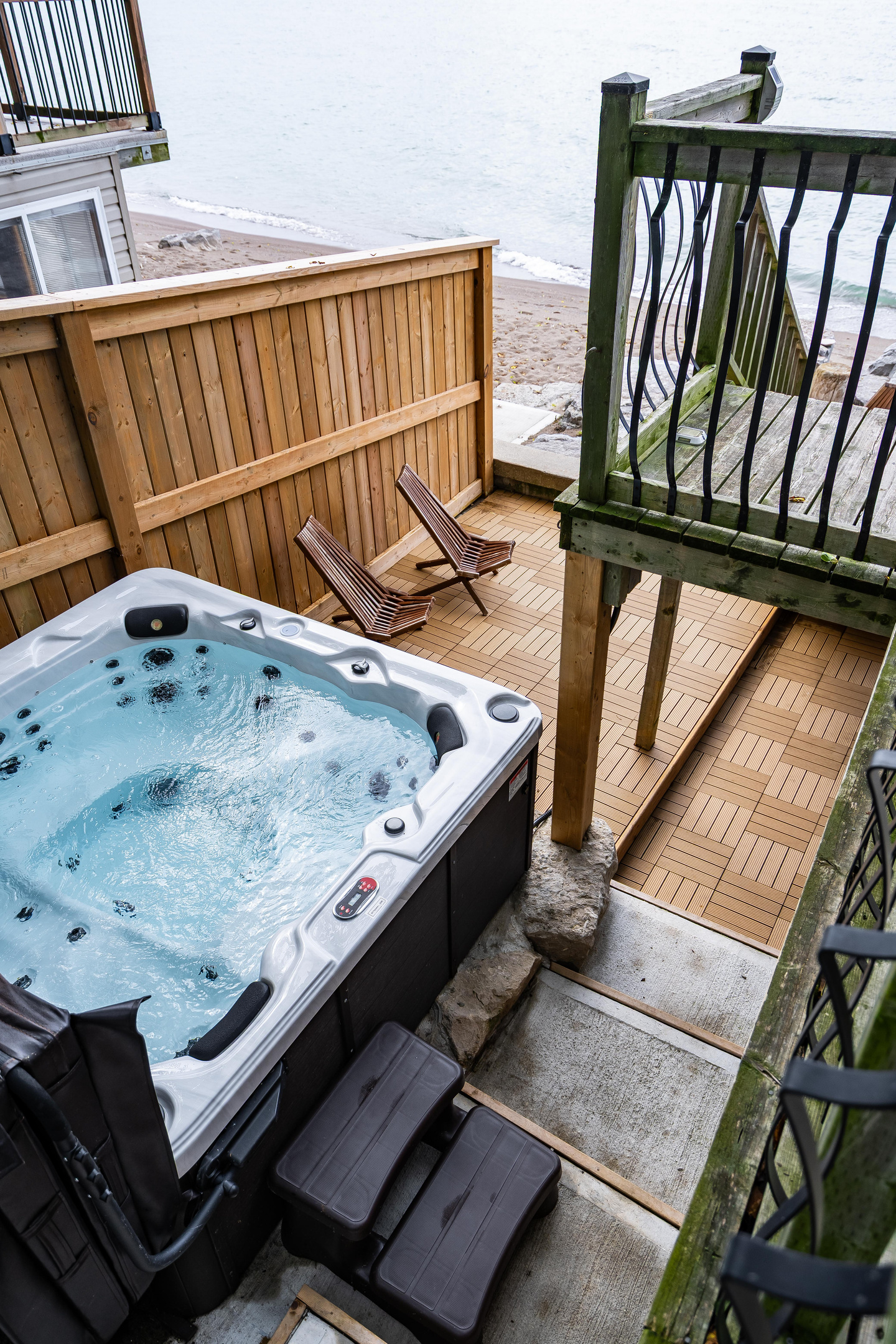 Outdoor hot tub with private deck seating