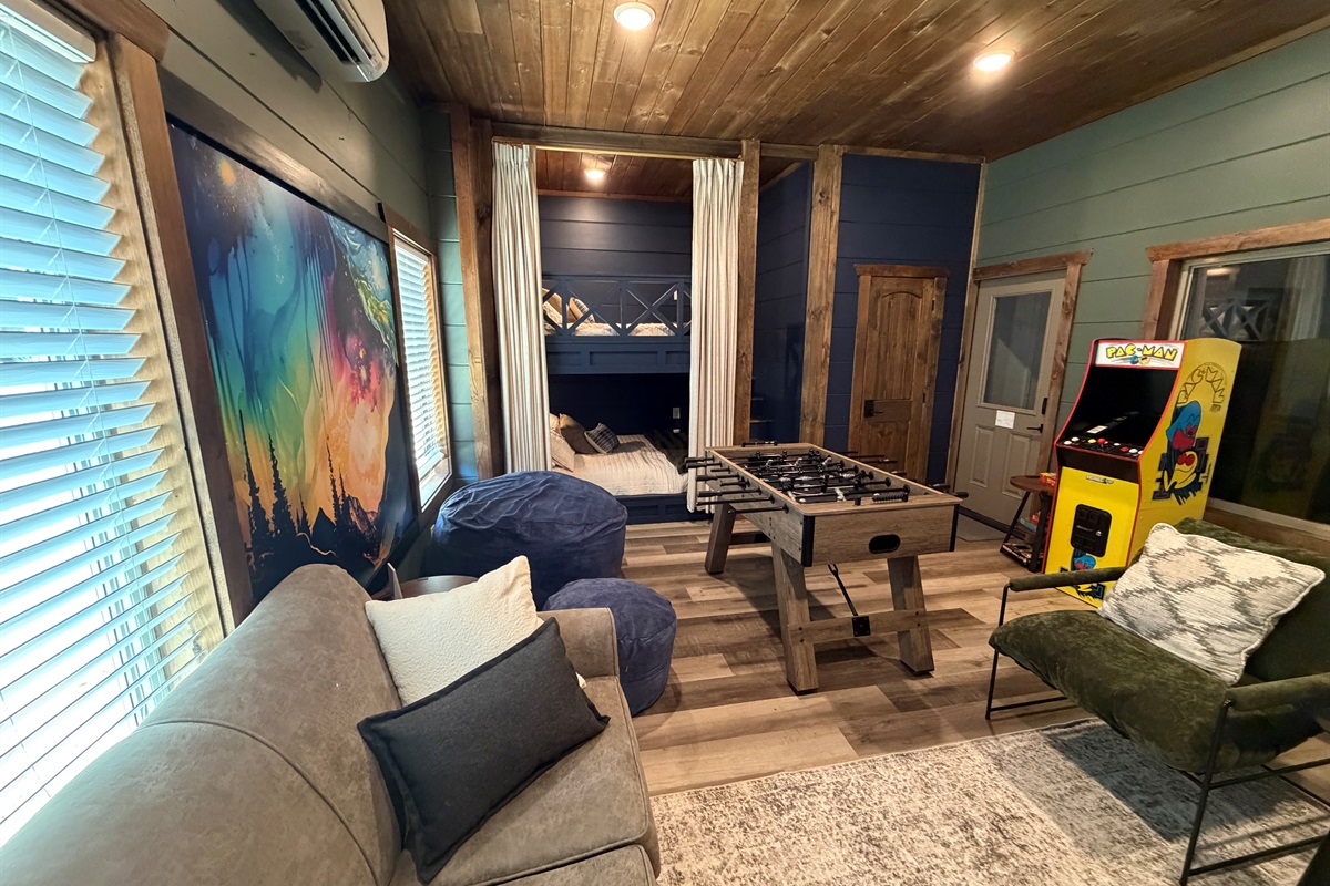 Football, PacMan, huge TV, games, beanbag and luxury queen bunks