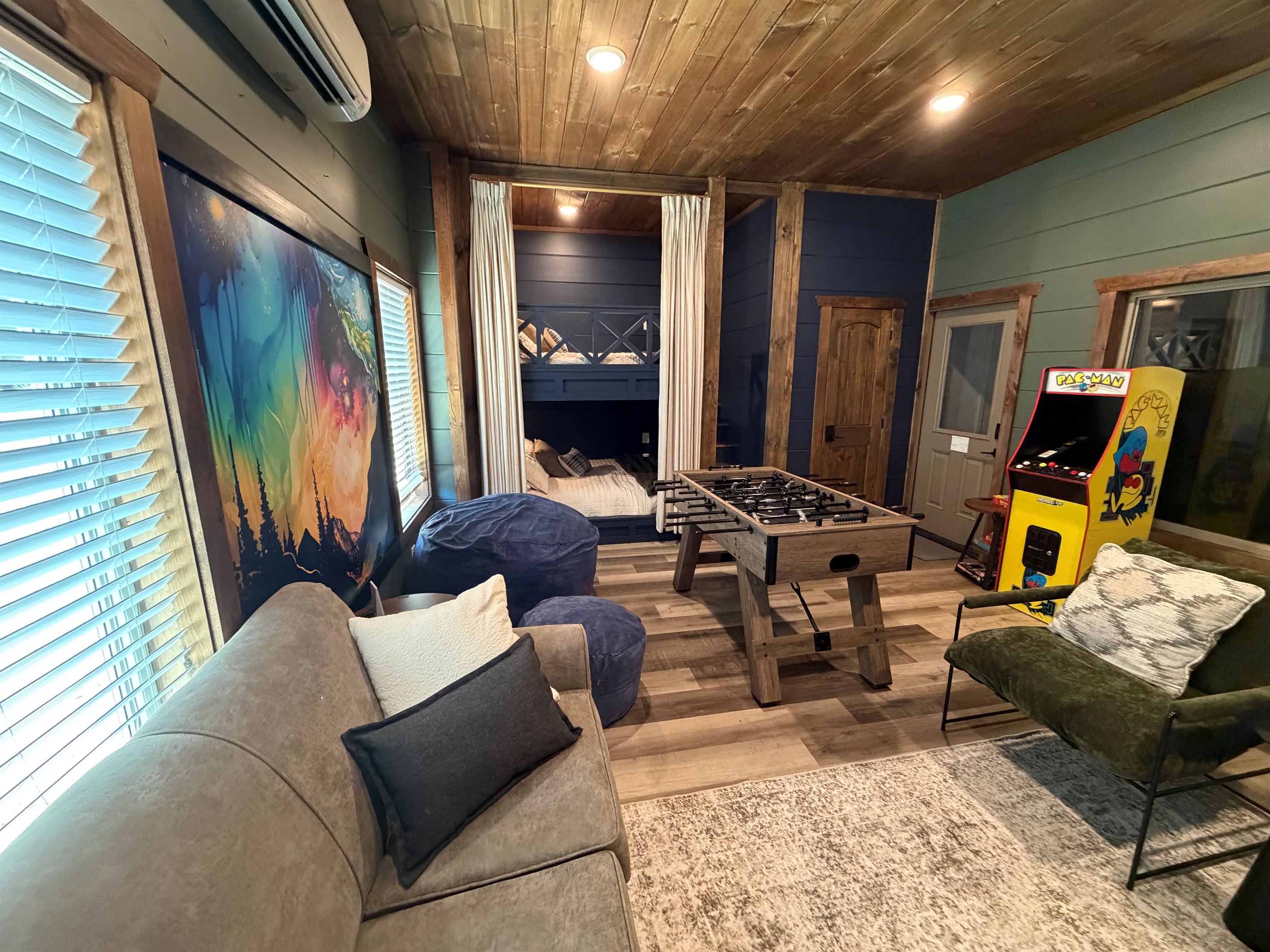 Football, PacMan, huge TV, games, beanbag and luxury queen bunks