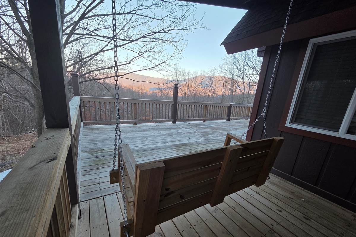 Take in the stunning mountain views as you unwind in the cozy swing on the deck.