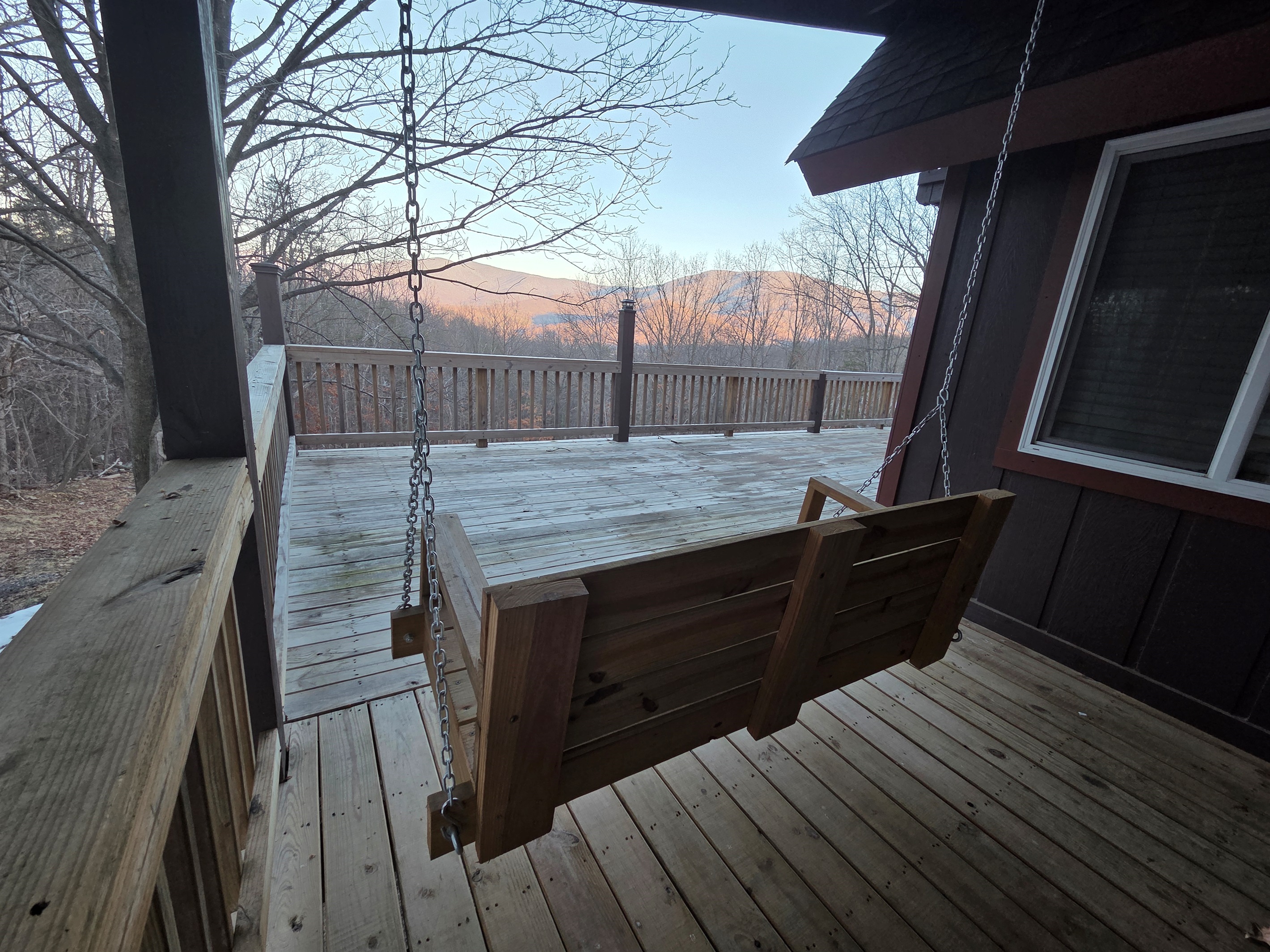 Take in the stunning mountain views as you unwind in the cozy swing on the deck.