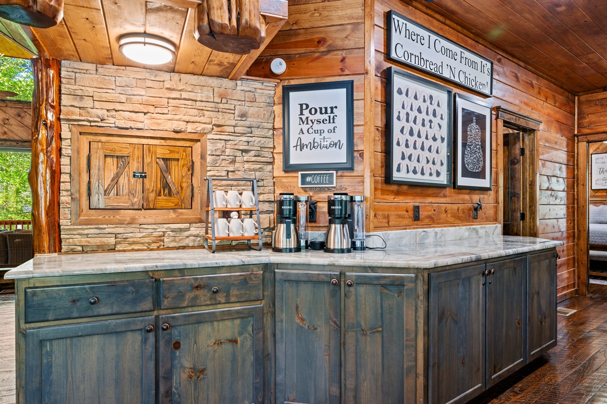 A convenient beverage and coffee station adds an extra touch, making mornings and late-night drinks effortless.