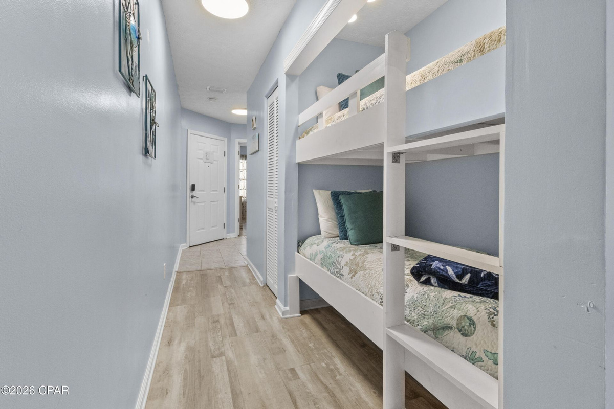 Hallway twin bunk beds — perfect for kids or extra guests, with easy bathroom access.