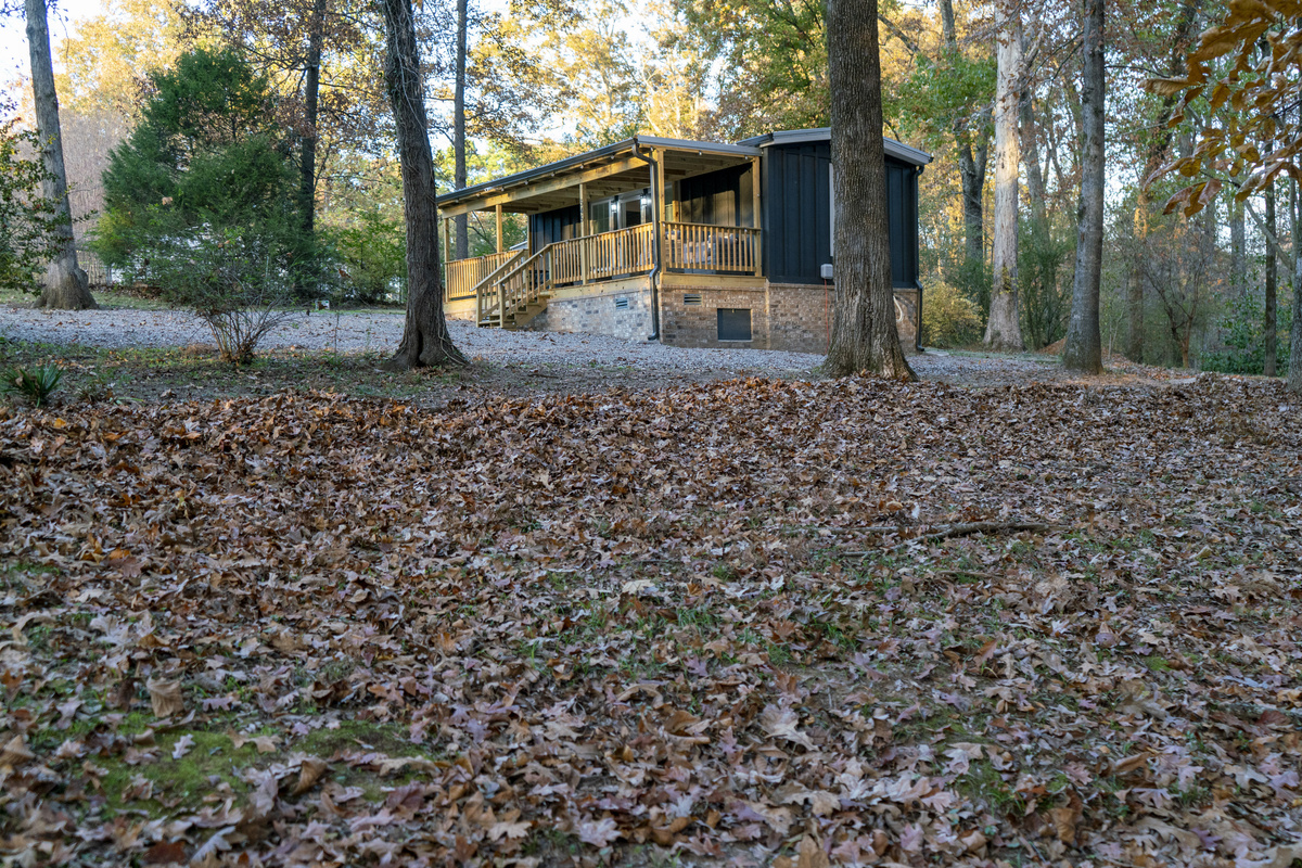 A cozy cabin surrounded by fall colors — the perfect place to relax, recharge, and enjoy the season.