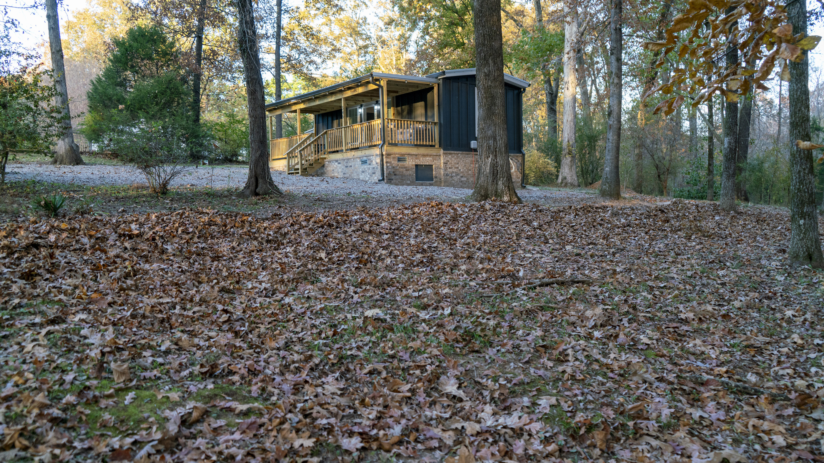 A cozy cabin surrounded by fall colors — the perfect place to relax, recharge, and enjoy the season.