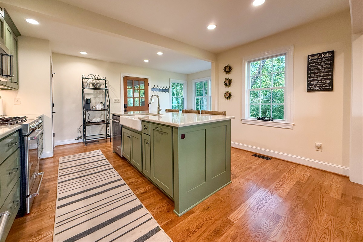 The farmhouse sink offers both style and function, perfect for large family meals or easy cleanup.