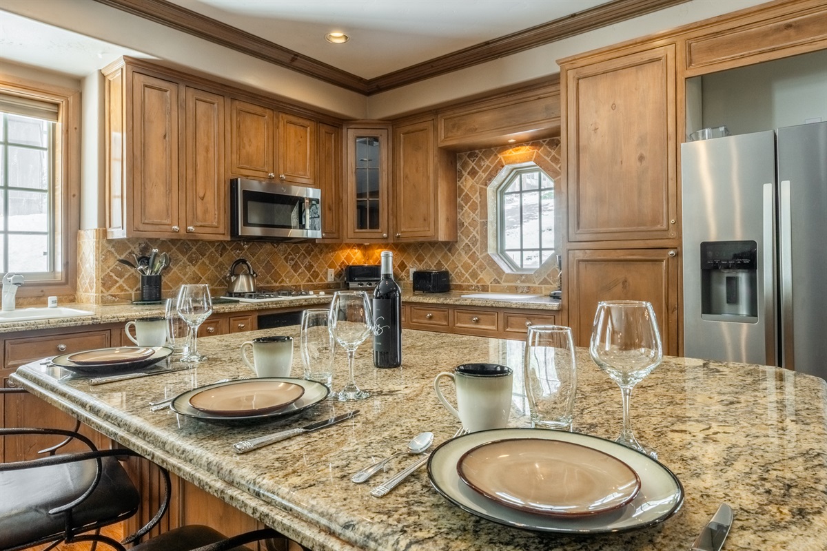 The breakfast bar offers additional seating and a casual spot for coffee, snacks, or planning the day’s adventures.