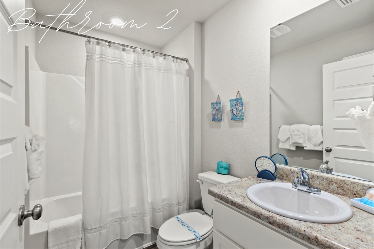 Bathroom 2 with shower-tub combo, ideal for families with kids or guests.