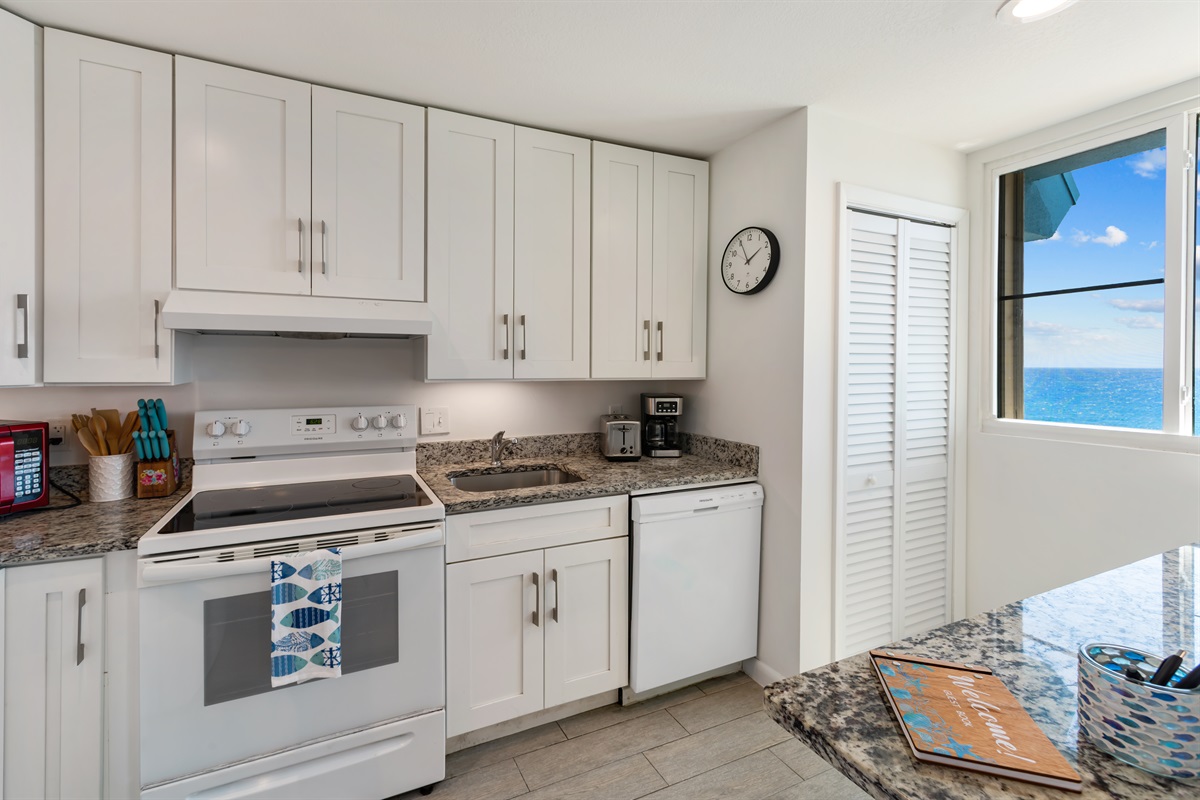 Well appointed kitchen with stove, oven, microwave and dishwasher