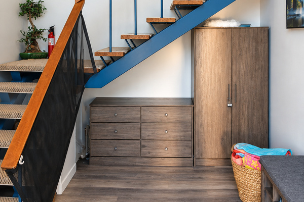 Entryway with stairs leading up to the king bedroom, providing easy access between the main living spaces and sleeping area.