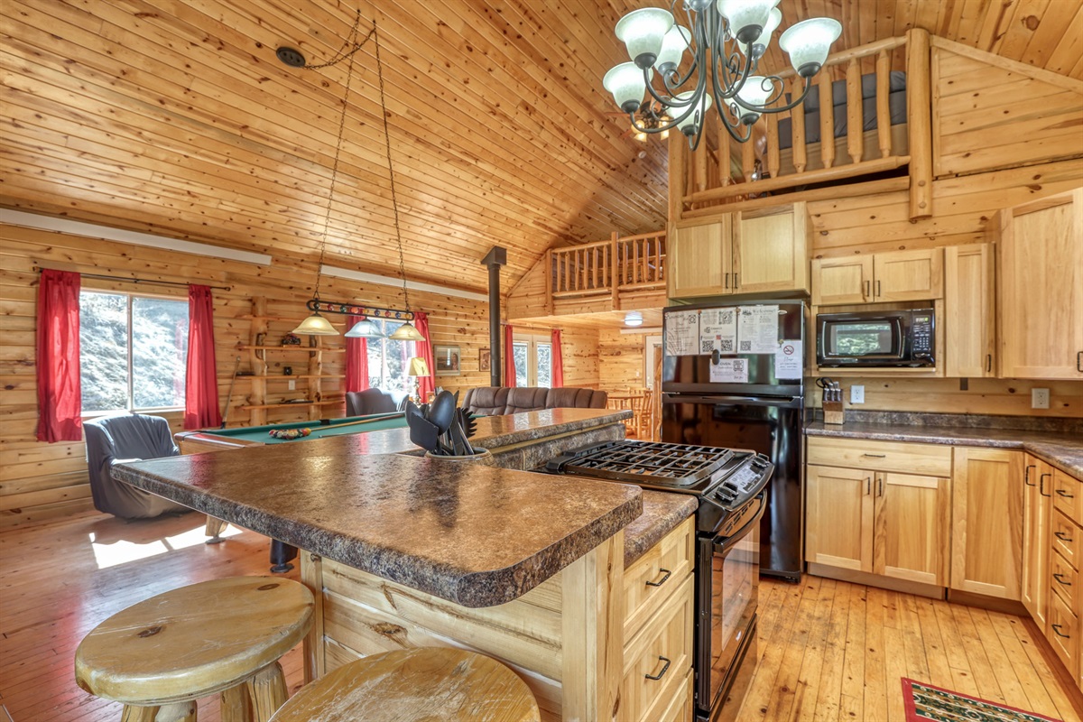 Kitchen with oven, stove, microwave