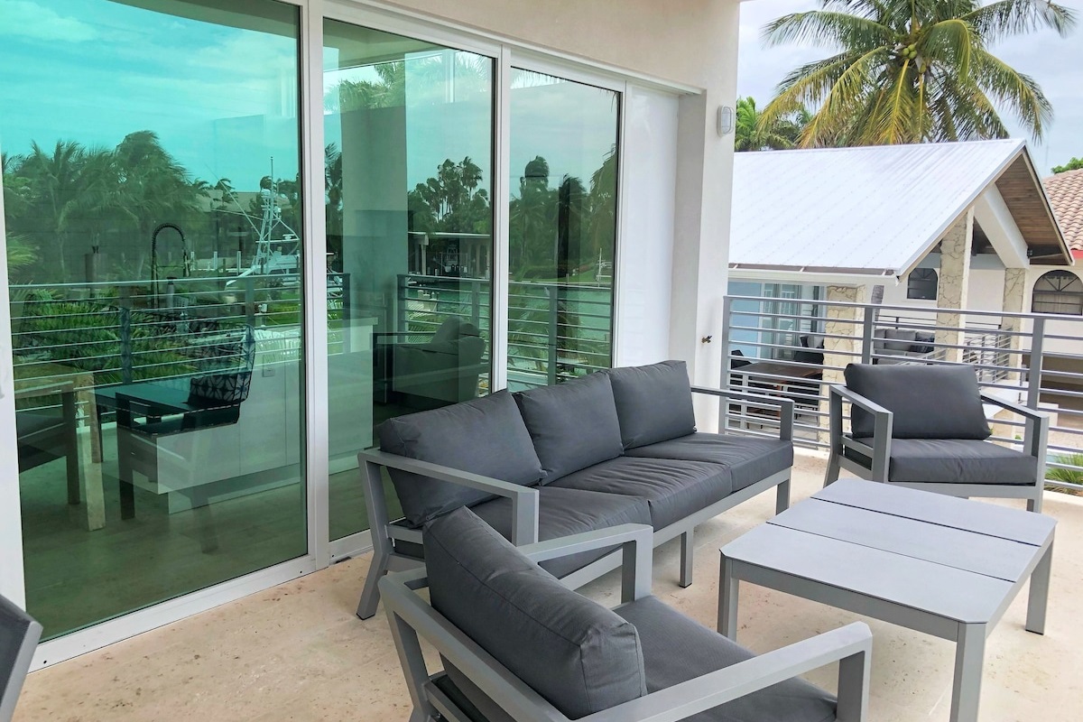 Comfortable Seating For Relaxing on The Veranda Overlooking The Pool and Canal