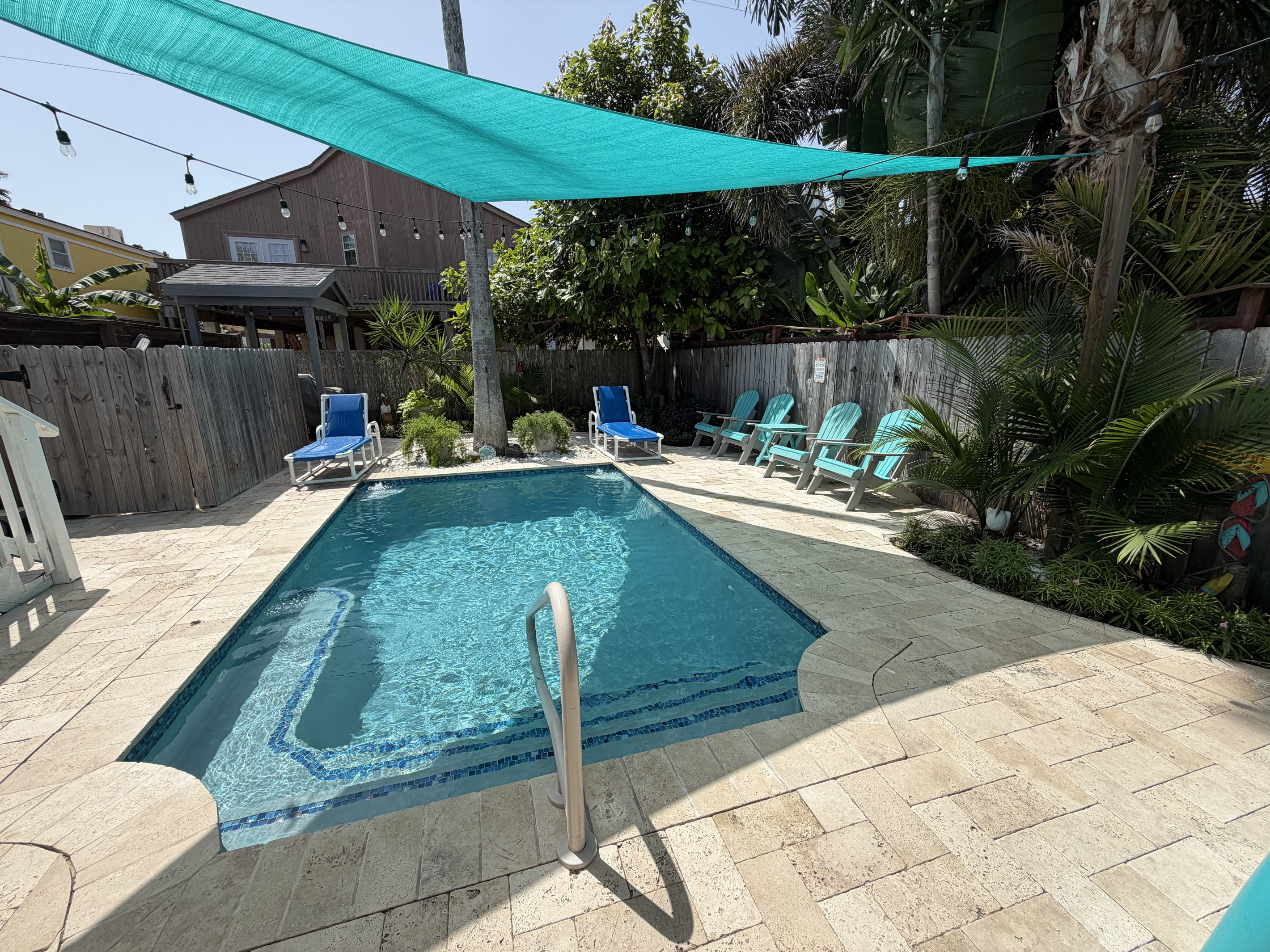 Landscaping compliments this tropical oasis.