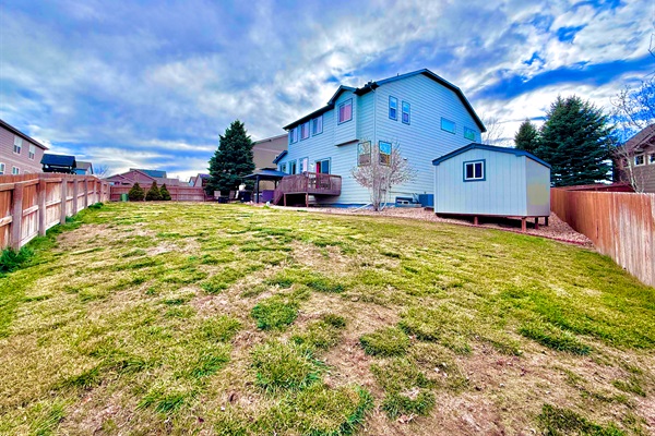 Expansive outdoor view showcasing the house from the right, offering a stunning perspective of the surrounding landscape