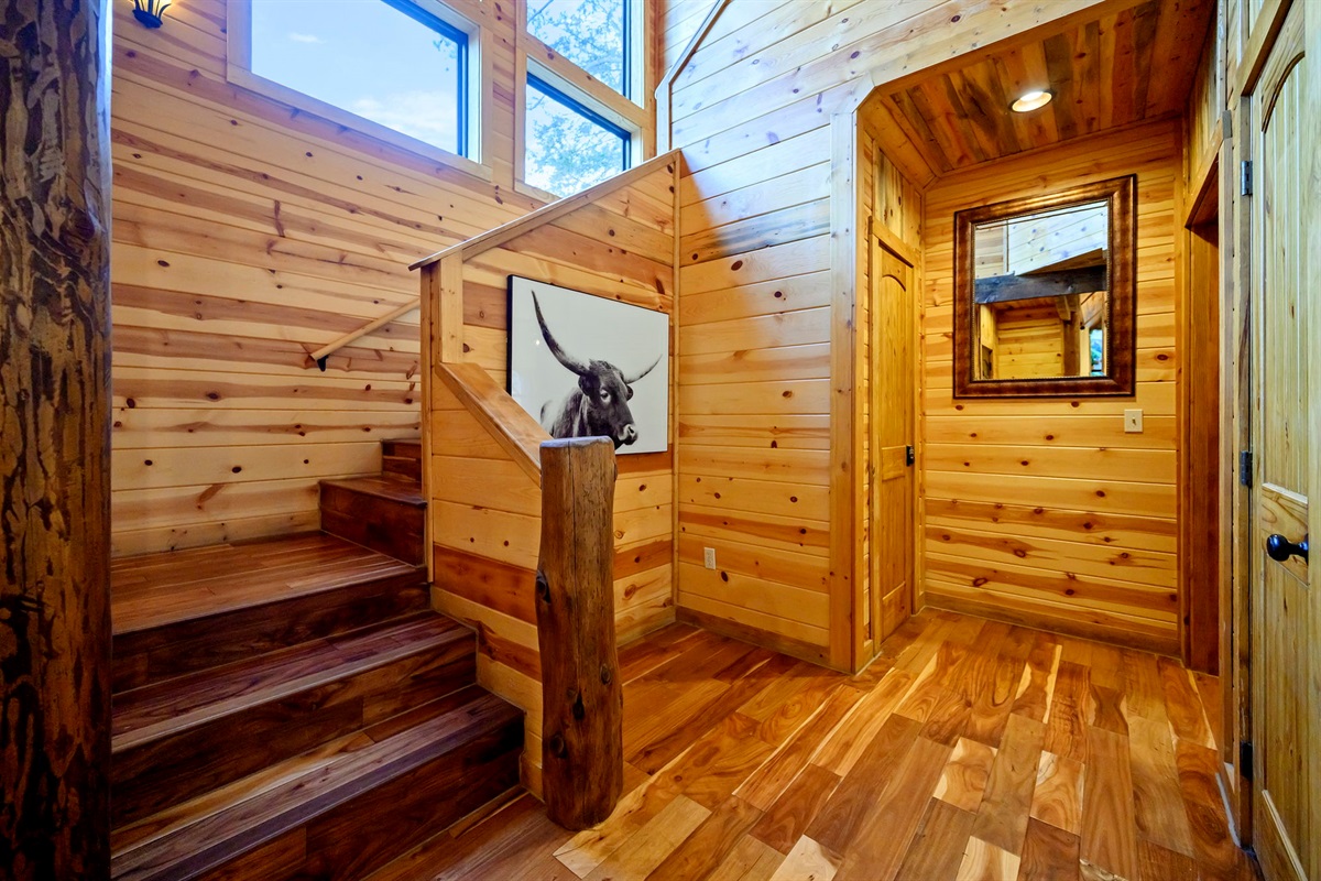 Rustic staircase leading to additional sleeping area