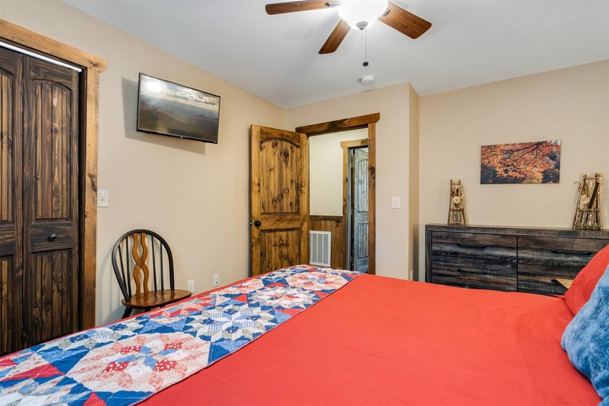 King-size bed, TV and dresser in back bedroom