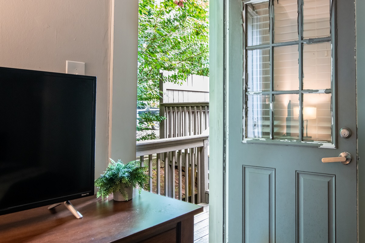 Private entryway with access to a small outdoor seating area — perfect for morning coffee.  