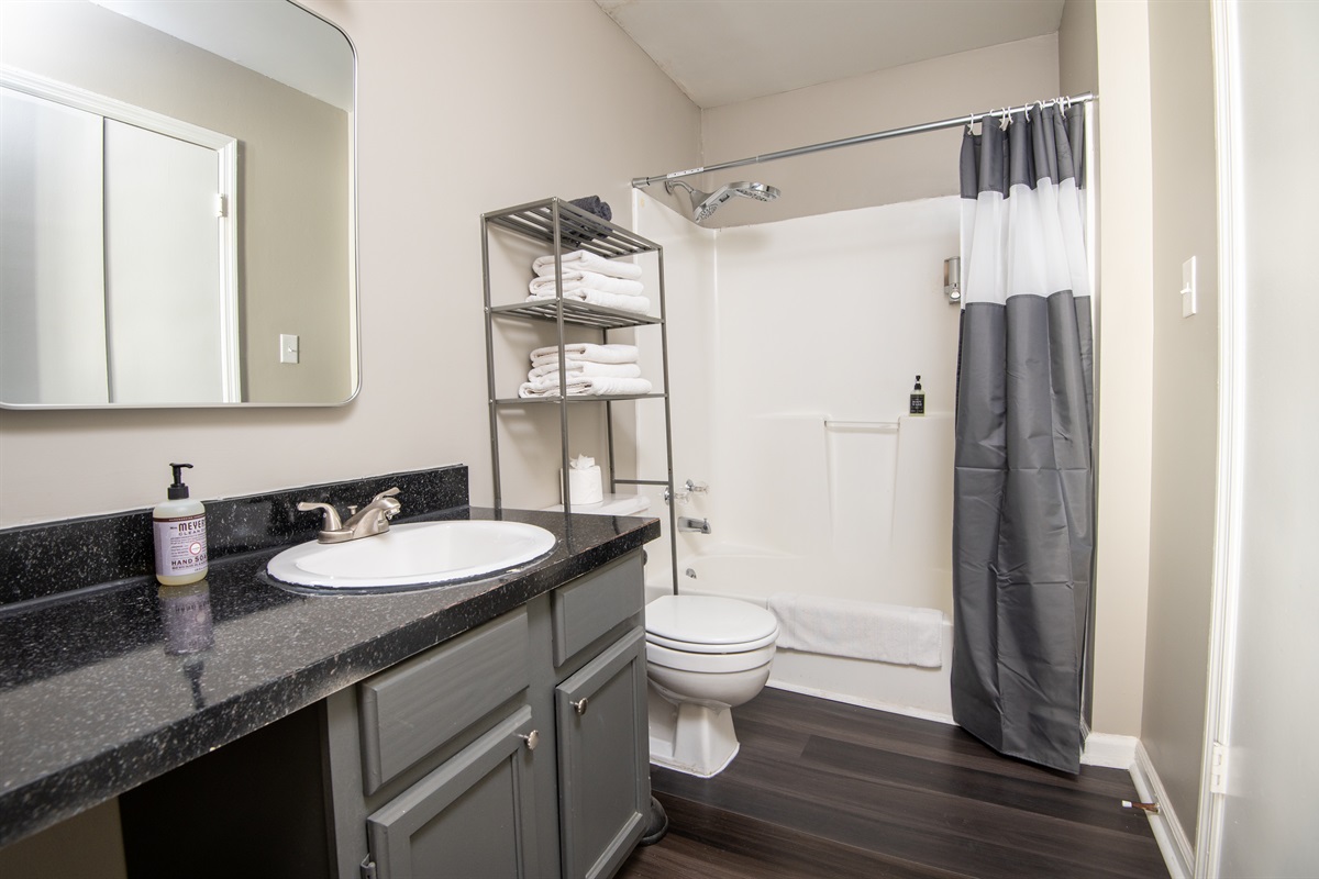 This ensuite bathroom is attached to the double queen room. Both bathrooms come complete with shampoo, body wash, conditioner, hand soap, and all the linens you need for a comfy stay.