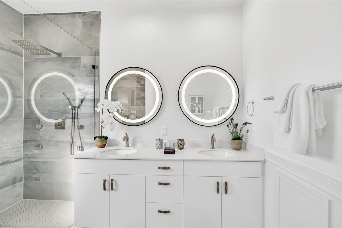 Dual vanities with lit mirrors